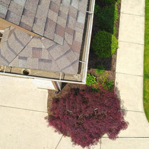 Carmel Roof Inspections – Gutters Sky view of the inside of the gutter with a drain.