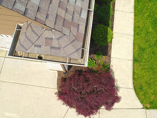 Carmel Roof Inspections – Gutters Sky view of the inside of the gutter with a drain.