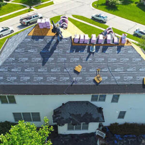 Indianapolis Roof Installations Stripped roof with just paper and shingle squares on the top