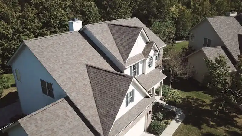 Avon Indiana Roof Replacement — Charcoal Architectural Shingles Aerial view of a completed roof replacement on a large two-story home in Avon Indiana featuring charcoal gray architectural shingles by Robert Stevens Roofing