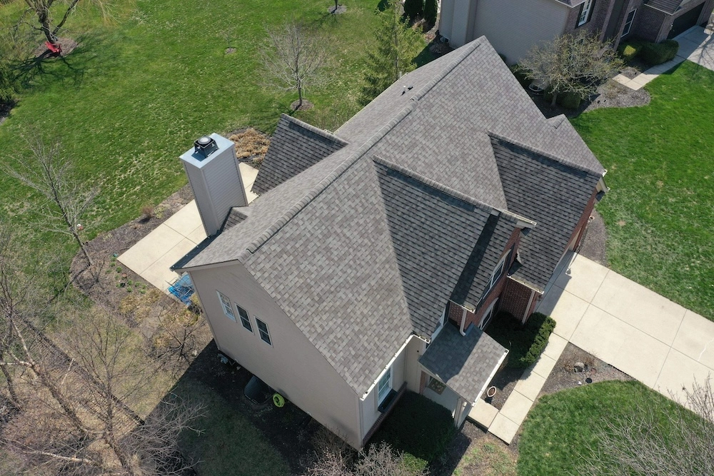 Aerial of Zionsville Roof Replacement by Robert Stevens Roofing Aerial view of a completed roof replacement on a large two-story home in Avon Indiana featuring charcoal gray architectural shingles by Robert Stevens Roofing