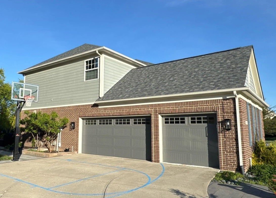 Home with new roof over garage completed by Zionsville Roofing Contractor, Robert Stevens Roofing