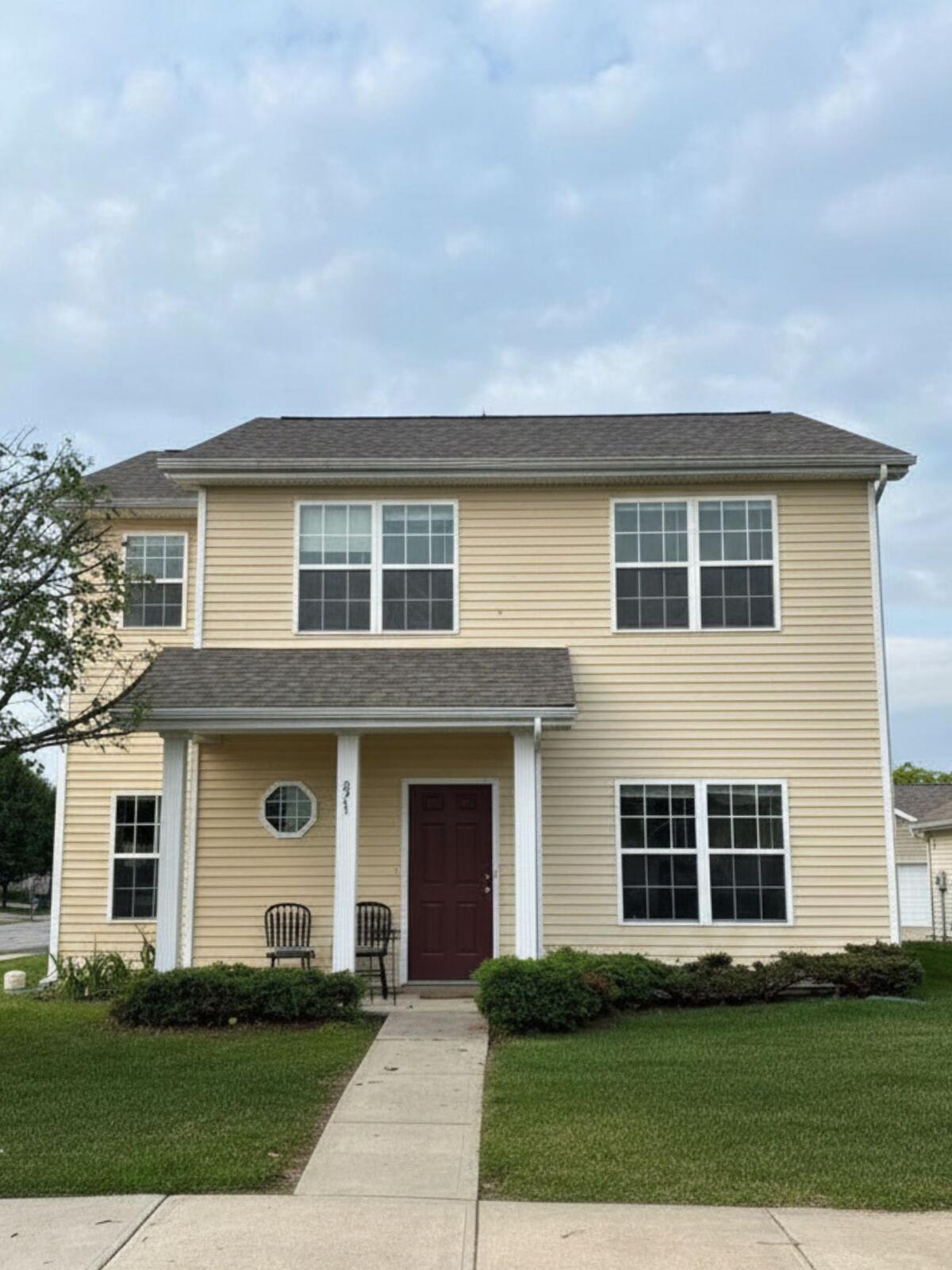 Completed roof repair on a two-story colonial home in Carmel, IN by Robert Stevens Roofing