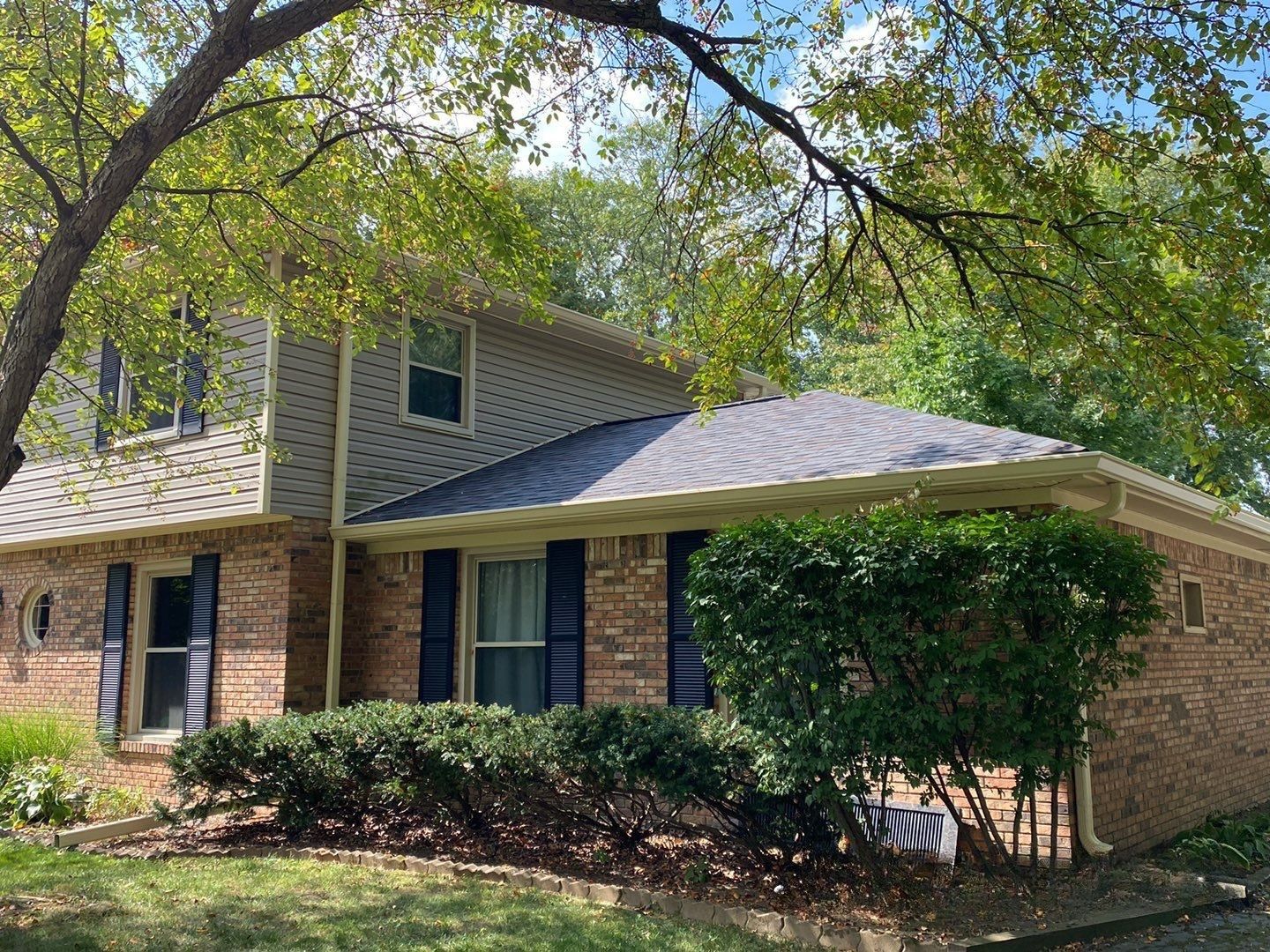 Carmel roofing repair completed on a hip roof brick home by Robert Stevens Roofing