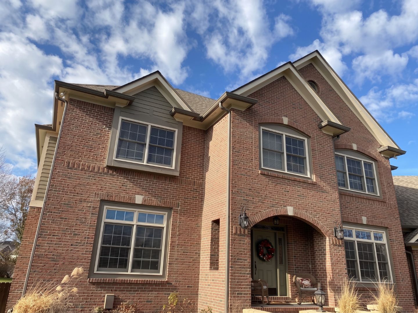 Carmel Roofing Companies — Brick Home Roof Replacement — Robert Stevens Roofing Completed roof replacement on a two-story brick home in Carmel, IN by Robert Stevens Roofing