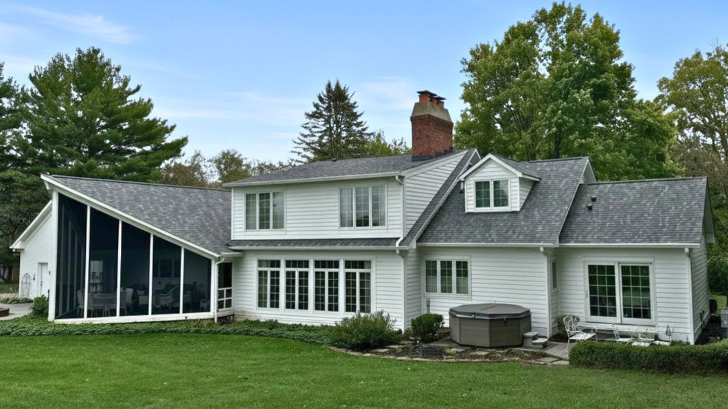 Carmel Roofing — Colonial Home Roof Replacement — Robert Stevens Roofing Completed asphalt shingle roof on a white colonial home in Carmel, IN by Robert Stevens Roofing