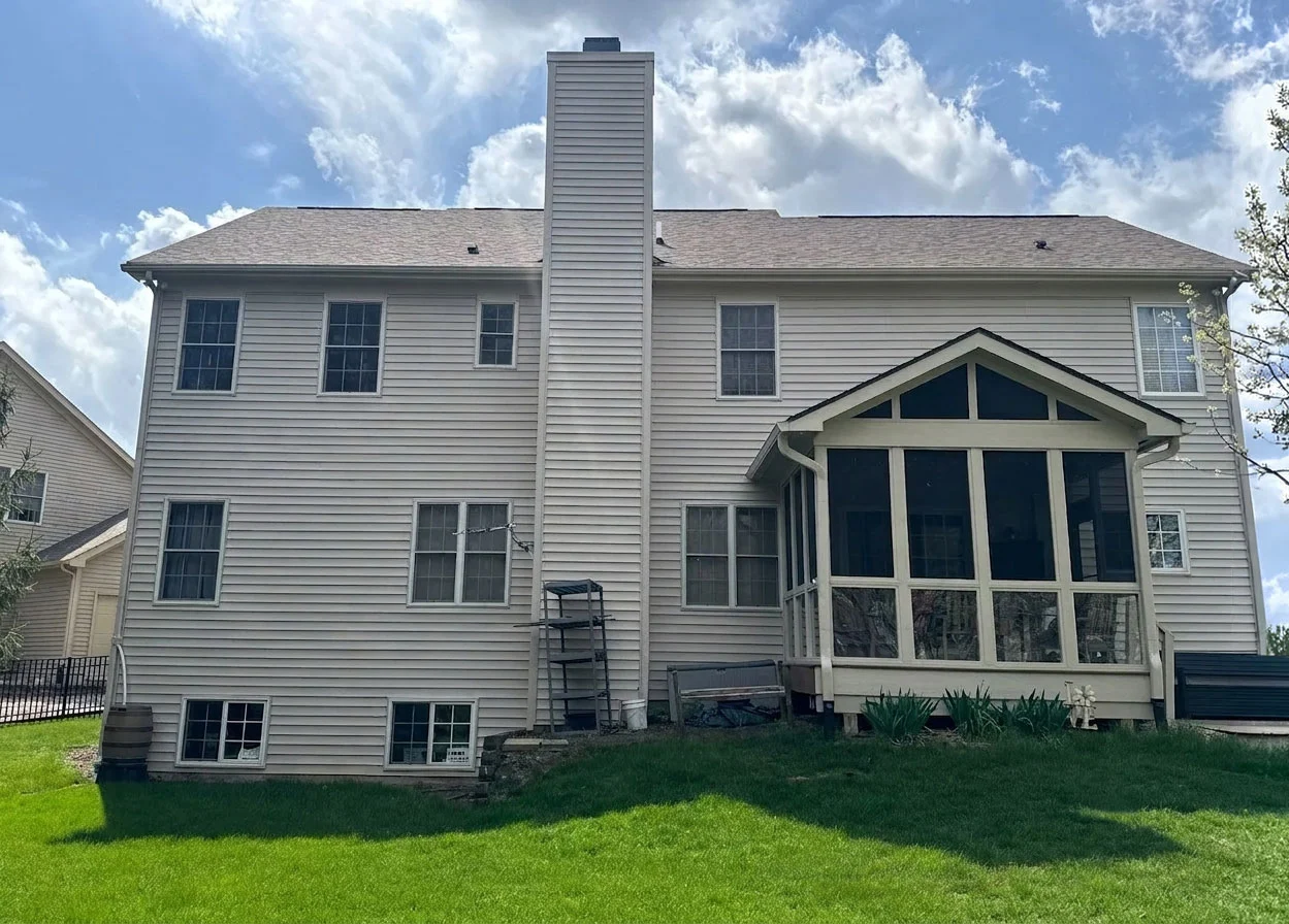 Westfield roofing project | Colonial home roof work Colonial home in Westfield with new roof installation, vinyl siding, screened porch, and central chimney